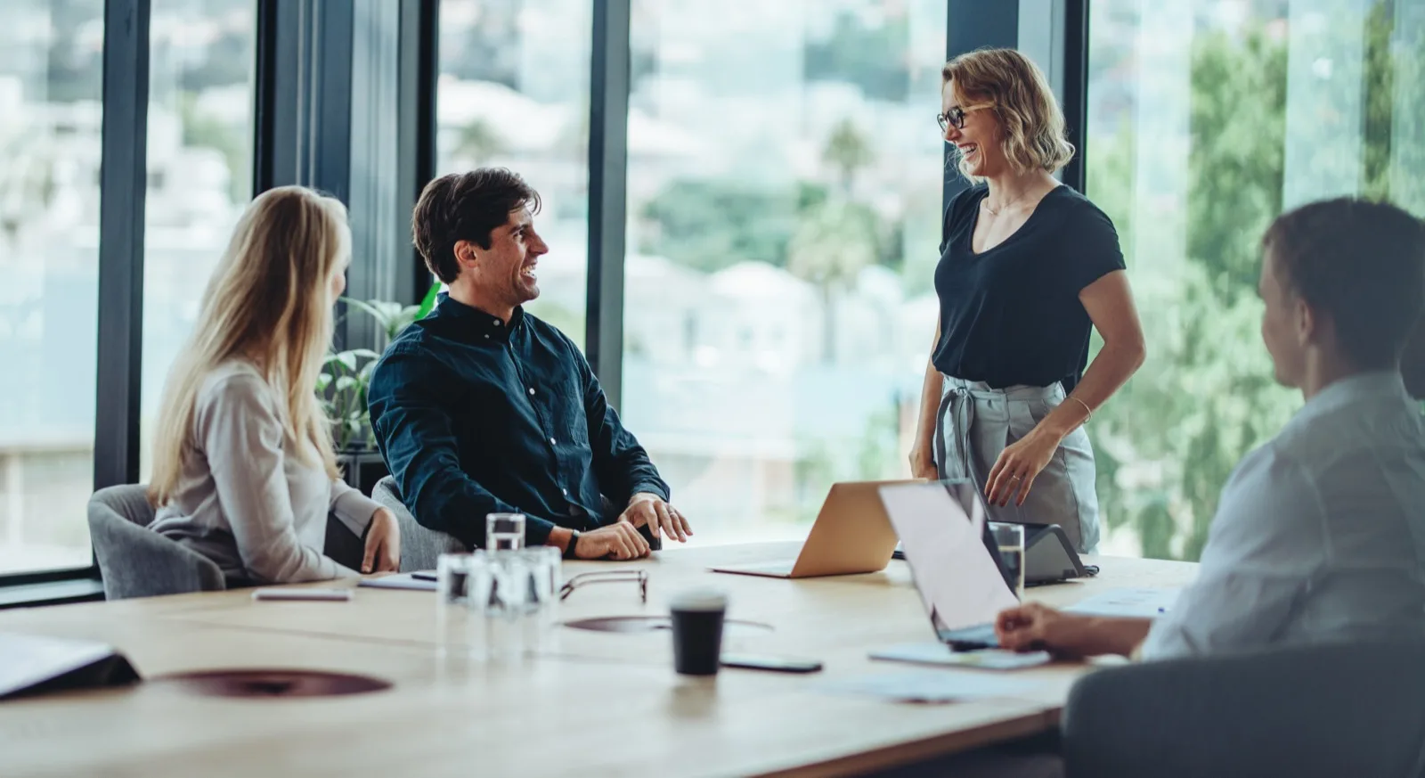 Woman presenting to team at leadership meeting
