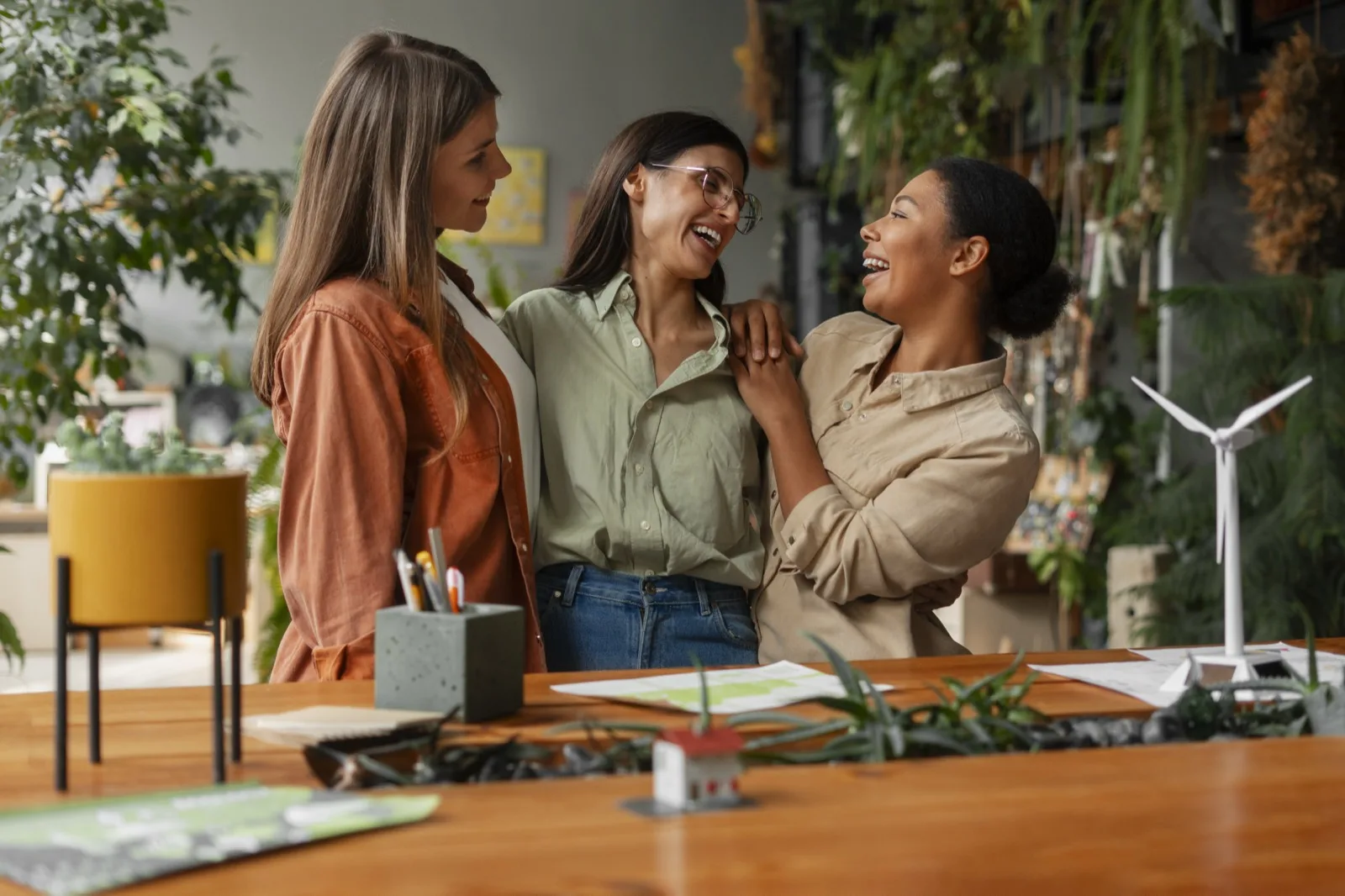 Women colleagues sharing a laugh in a collaborative office